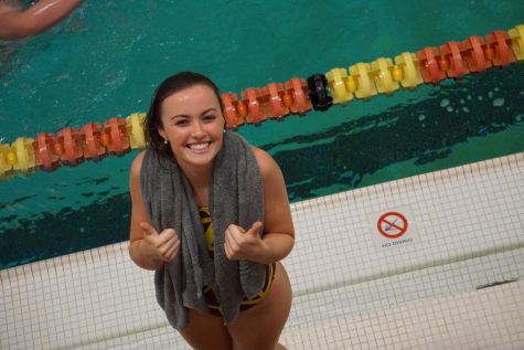 Sophia Ginochetti smiles after she broke her own pool and school record